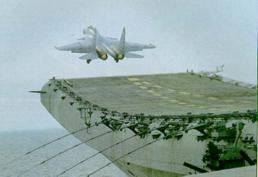 Истребитель Су-33 взлетает с палубы авианесущего крейсера